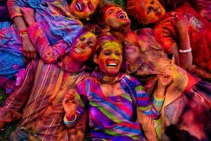 Young people smile in Jaipur during Holi Festival